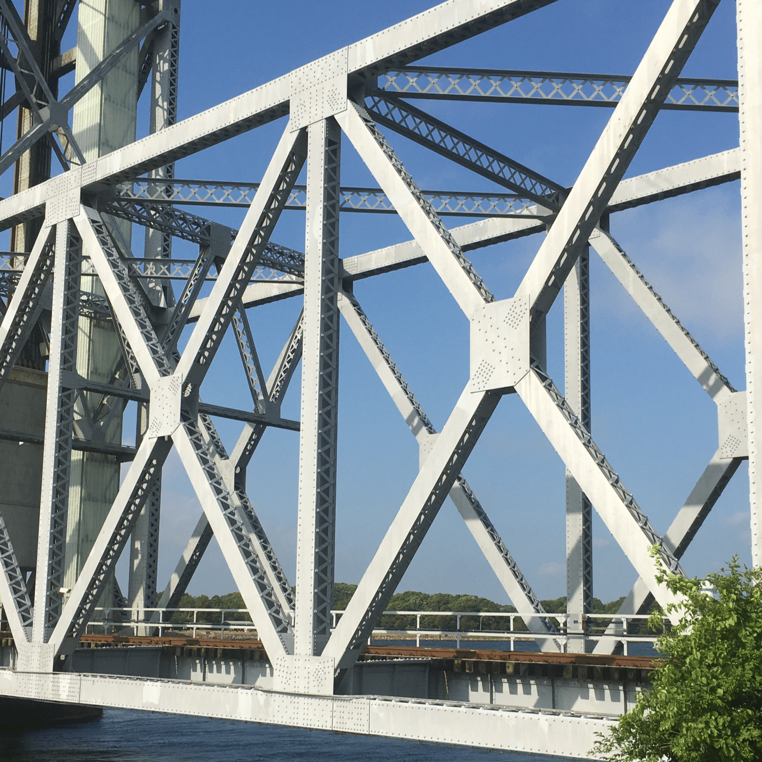Truss bridge with riveted gusset plates.